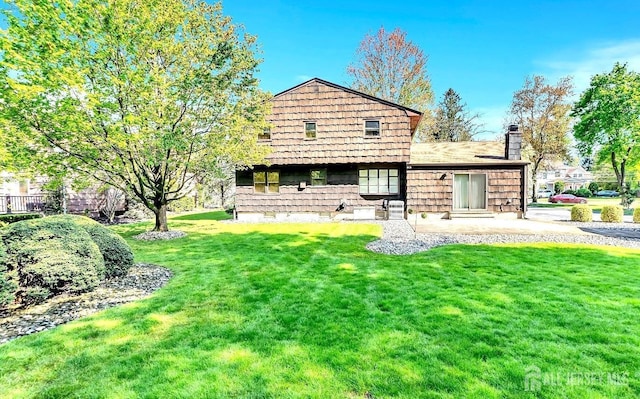 3996 Park Ave, Edison, NJ 08820 - back of property with a yard and a chimney