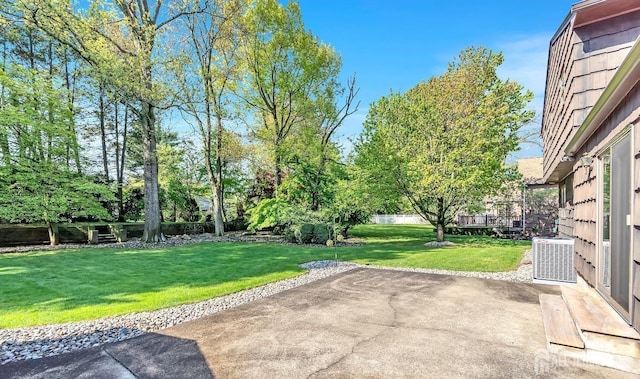 3996 Park Ave, Edison, NJ 08820 - view of green lawn featuring a patio and central AC