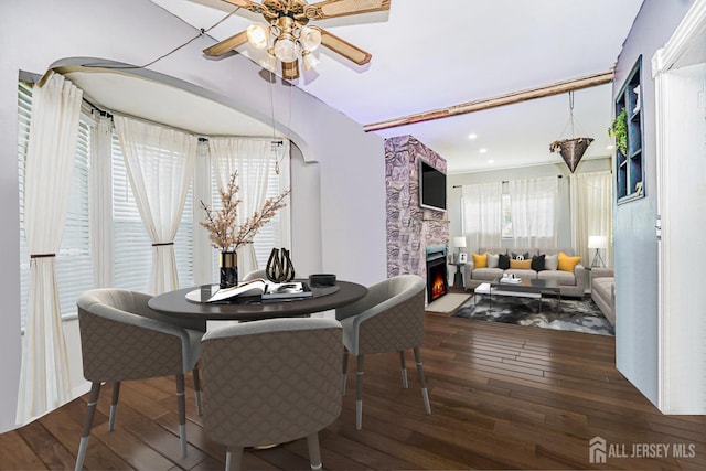 10 W Church St, Jamesburg, NJ 08831 - dining area featuring a large fireplace, hardwood / wood-style floors, a ceiling fan, arched walkways, and recessed lighting