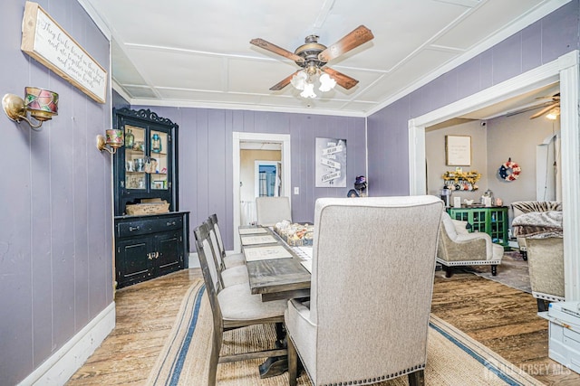 10 W Church St, Jamesburg, NJ 08831 - dining area with ceiling fan, crown molding, wood finished floors, and wooden walls