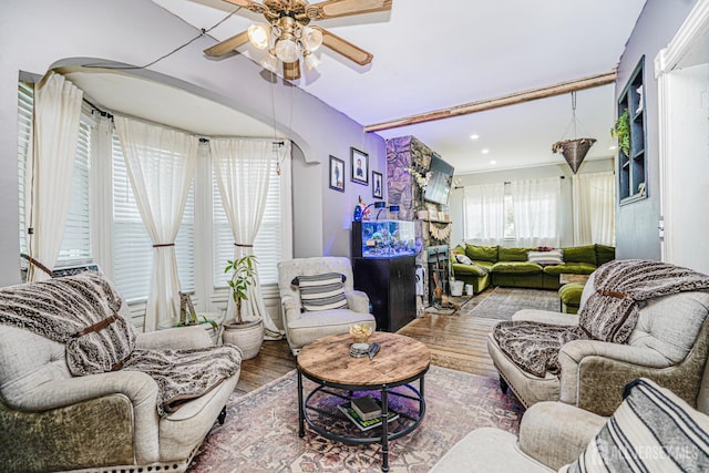 10 W Church St, Jamesburg, NJ 08831 - living room featuring wood finished floors, a fireplace, a ceiling fan, recessed lighting, and arched walkways