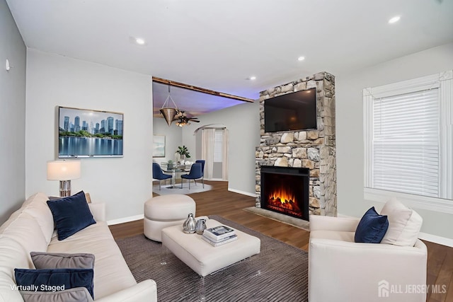 10 W Church St, Jamesburg, NJ 08831 - living room with wood finished floors, a fireplace, recessed lighting, and arched walkways