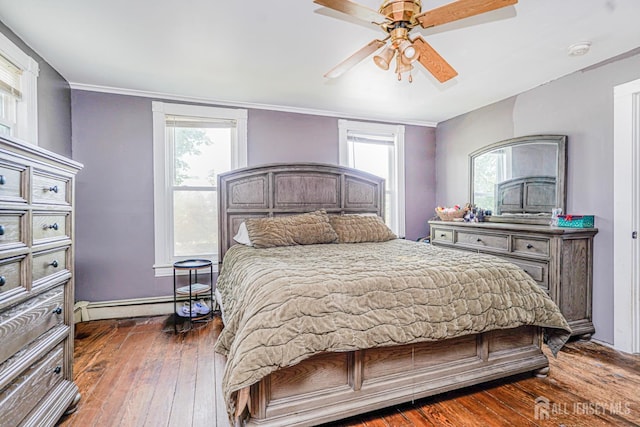 10 W Church St, Jamesburg, NJ 08831 - bedroom with baseboard heating, dark wood-type flooring, ornamental molding, and ceiling fan