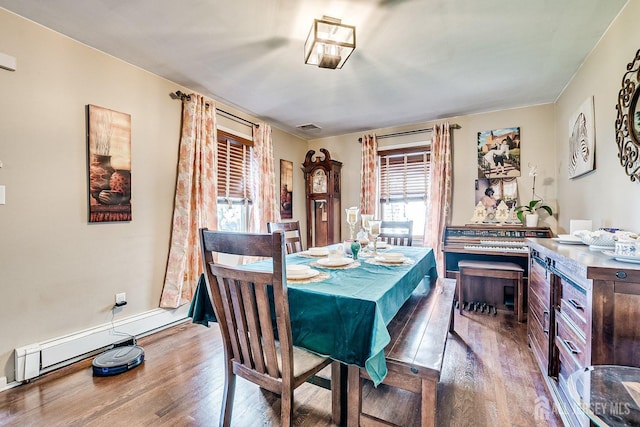 114 Garden Ter, Edison, NJ 08817 - dining area with wood finished floors and a baseboard heating unit