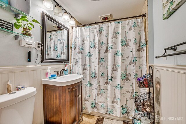 114 Garden Ter, Edison, NJ 08817 - bathroom with wainscoting, vanity, and a shower with curtain