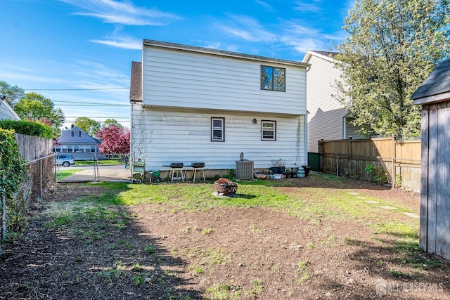 114 Garden Ter, Edison, NJ 08817 - back of property featuring a fenced backyard and an outdoor fire pit