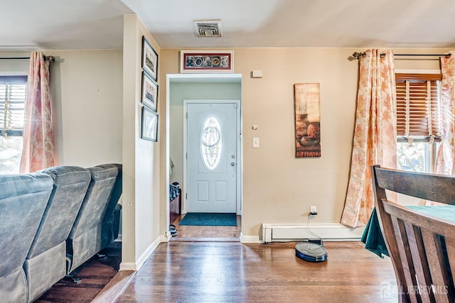 114 Garden Ter, Edison, NJ 08817 - foyer with a baseboard heating unit and wood finished floors