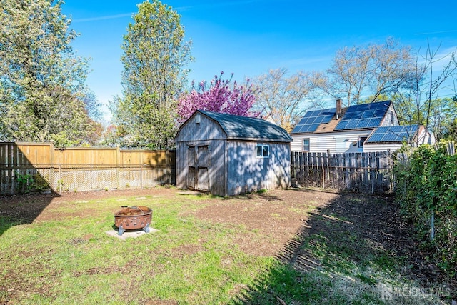 114 Garden Ter, Edison, NJ 08817 - fenced backyard featuring an outdoor fire pit and a shed