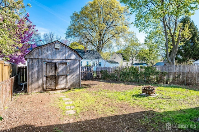 114 Garden Ter, Edison, NJ 08817 - fenced backyard with a fire pit and a shed