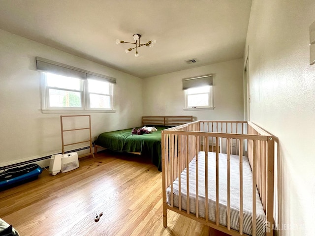 bedroom featuring wood-type flooring