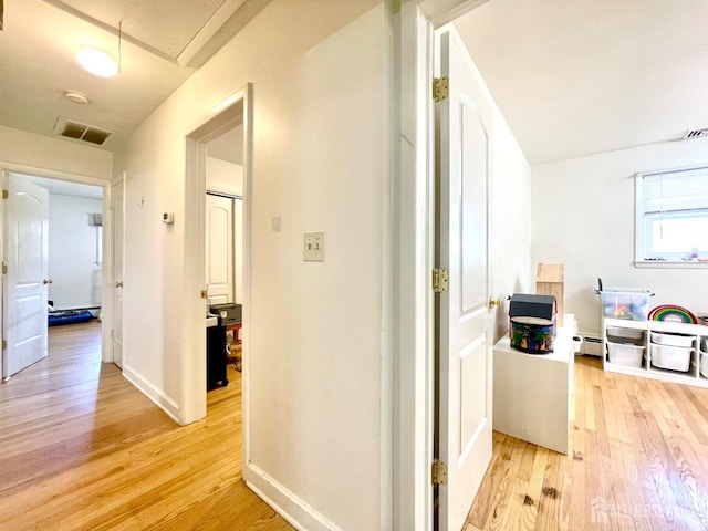 hall featuring light hardwood / wood-style flooring and a baseboard radiator