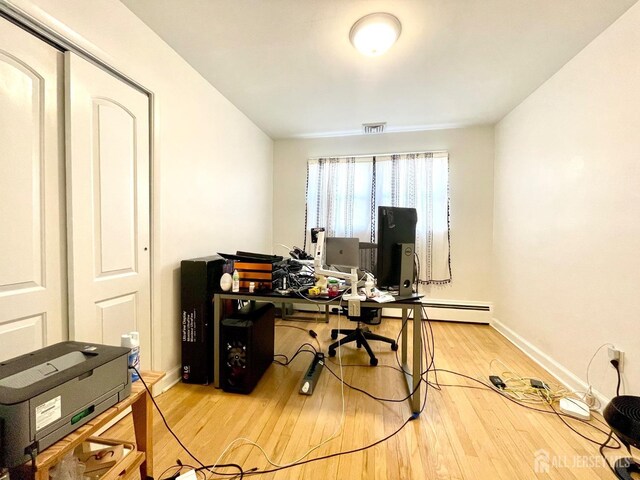 office with hardwood / wood-style flooring