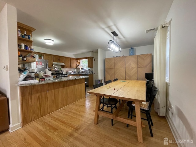 dining area with light wood-type flooring