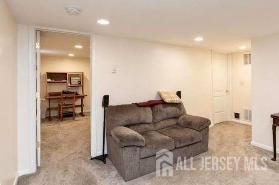 living room with light colored carpet