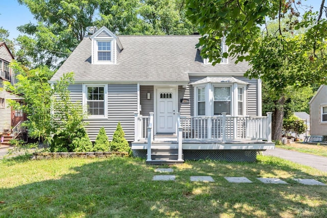 261 New Market Rd, Dunellen, NJ 08812 - cape cod home with a shingled roof and a front lawn