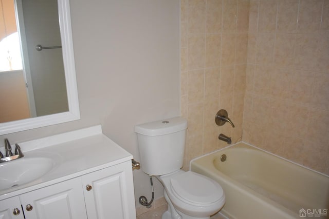 full bathroom featuring vanity, toilet, and tiled shower / bath