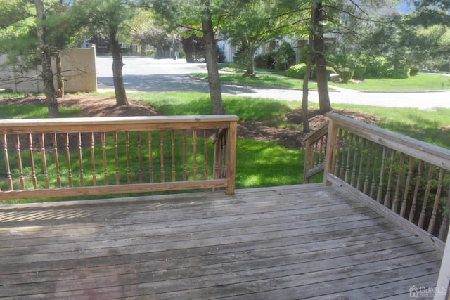 deck featuring a lawn