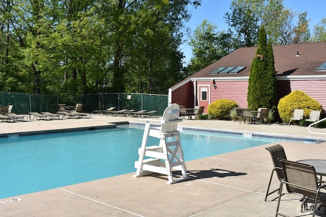 view of swimming pool with a patio