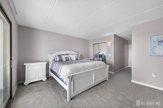 carpeted bedroom with baseboards