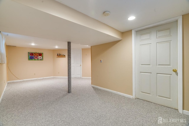 basement featuring light colored carpet