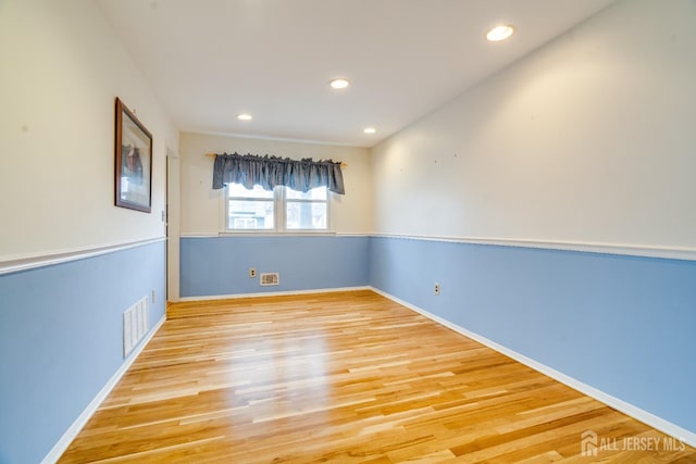 spare room with light hardwood / wood-style floors