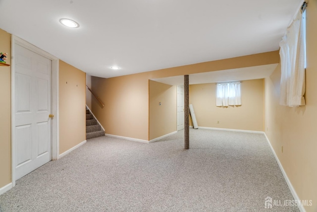 basement with light colored carpet