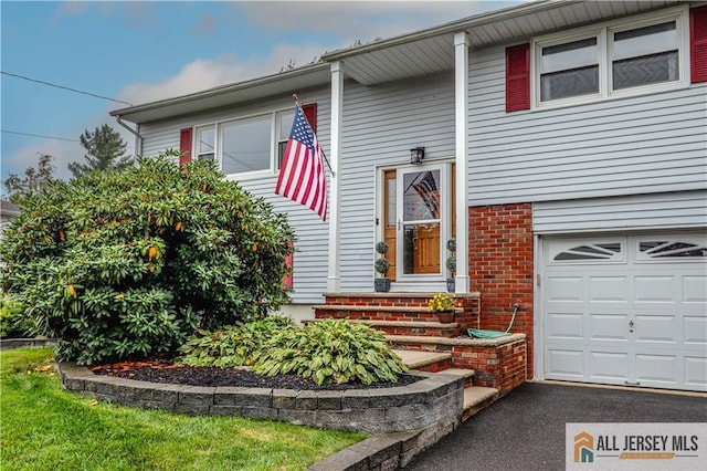 view of front of property with a garage