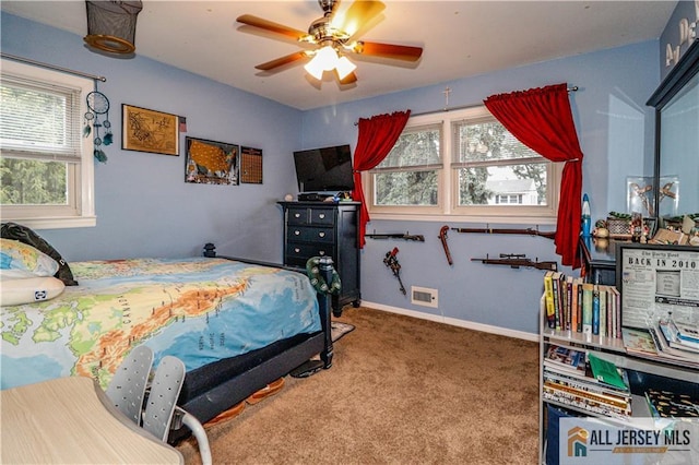 carpeted bedroom with ceiling fan