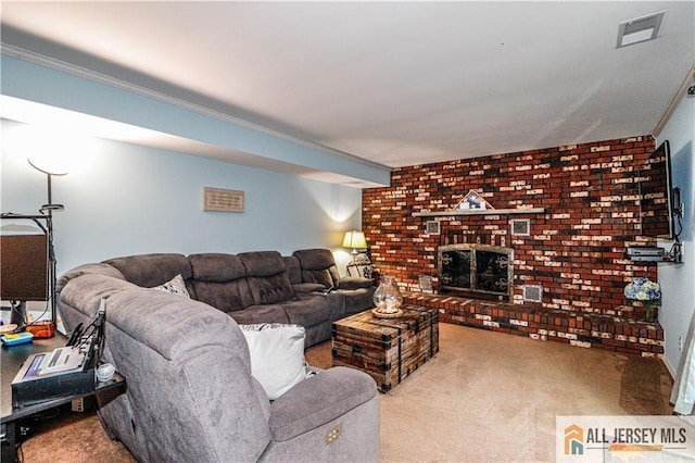 carpeted living room with a brick fireplace and crown molding