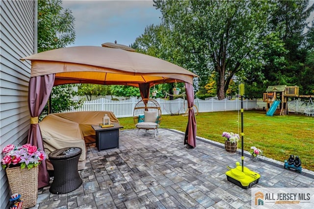 view of patio featuring a gazebo and a playground