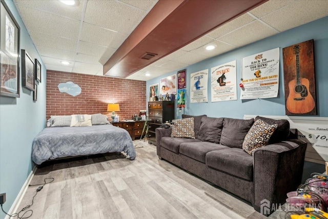 11 Cardinal Ct, Old Bridge, NJ 08857 - bedroom with brick wall, a drop ceiling, wood finished floors, and recessed lighting