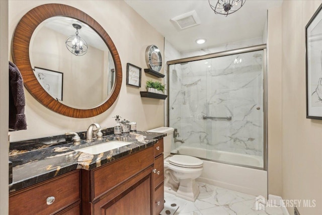 11 Cardinal Ct, Old Bridge, NJ 08857 - bathroom with marble look tiles, bath / shower combo with glass door, vanity, and toilet