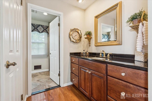 11 Cardinal Ct, Old Bridge, NJ 08857 - bathroom featuring vanity, wood finished floors, and baseboards