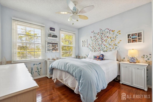 11 Cardinal Ct, Old Bridge, NJ 08857 - bedroom featuring dark wood-style flooring, a textured ceiling, baseboards, and a ceiling fan