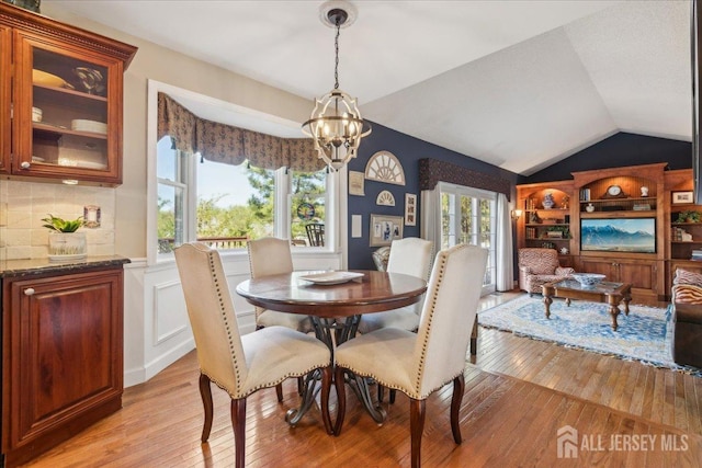 11 Cardinal Ct, Old Bridge, NJ 08857 - dining space with light wood-style flooring, lofted ceiling, and a chandelier