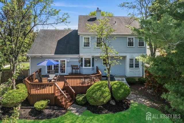11 Cardinal Ct, Old Bridge, NJ 08857 - rear view of property featuring a chimney, a deck, and a shingled roof