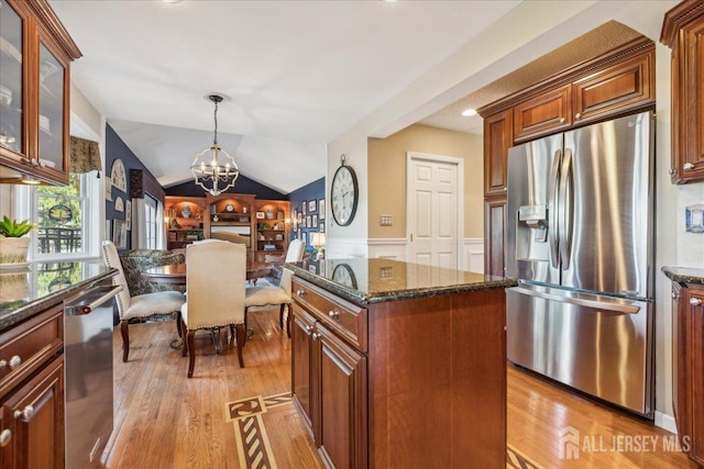 11 Cardinal Ct, Old Bridge, NJ 08857 - kitchen with appliances with stainless steel finishes, light wood-style floors, a chandelier, dark stone countertops, and a center island