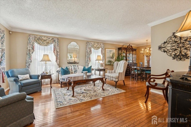 11 Cardinal Ct, Old Bridge, NJ 08857 - living area with a chandelier, a textured ceiling, hardwood / wood-style floors, and crown molding