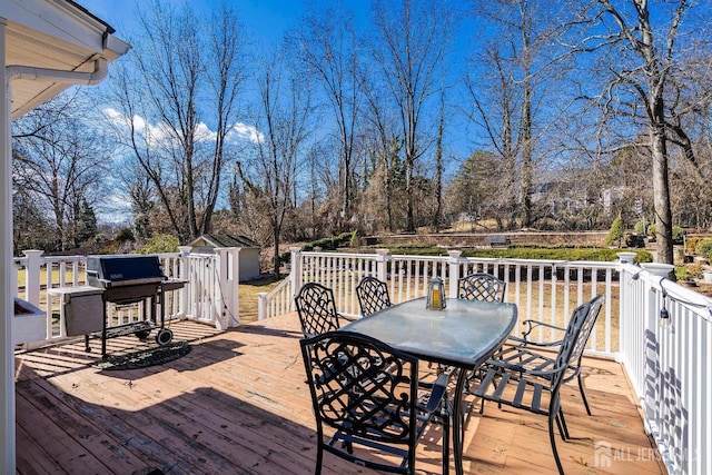 108 Colonia Rd, Colonia, NJ 07067 - wooden deck featuring outdoor dining area, an outdoor structure, a grill, and a storage shed