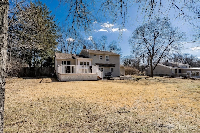 108 Colonia Rd, Colonia, NJ 07067 - back of property with a chimney, fence, a deck, and a lawn