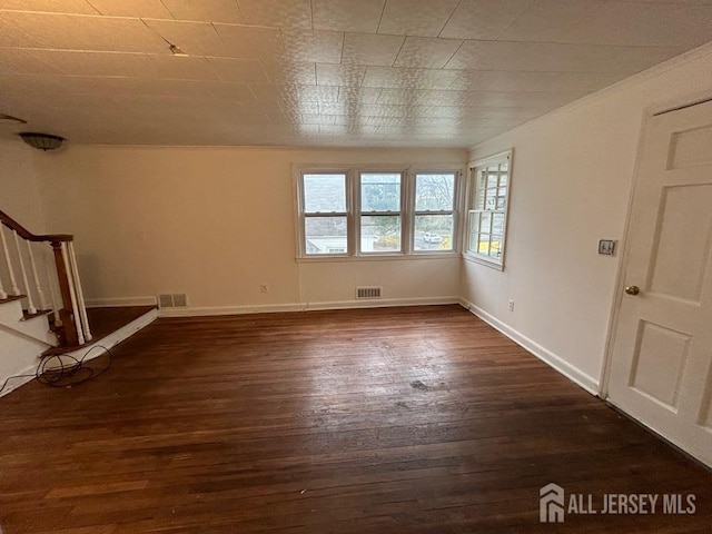 803 W Inman Ave W, Rahway, NJ 07065 - unfurnished room with visible vents, baseboards, dark wood-style floors, and stairs