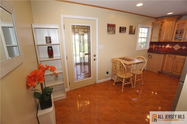 25 Clover Ave, Colonia, NJ 07067 - kitchen with dark countertops, ornamental molding, glass insert cabinets, recessed lighting, and brown cabinetry