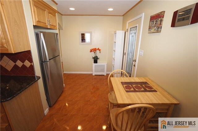 25 Clover Ave, Colonia, NJ 07067 - kitchen featuring freestanding refrigerator, decorative backsplash, ornamental molding, recessed lighting, and tile patterned floors