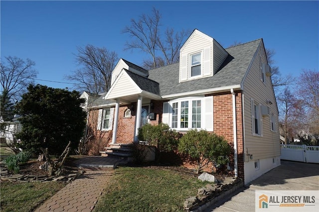 25 Clover Ave, Colonia, NJ 07067 - new england style home with brick siding and a shingled roof
