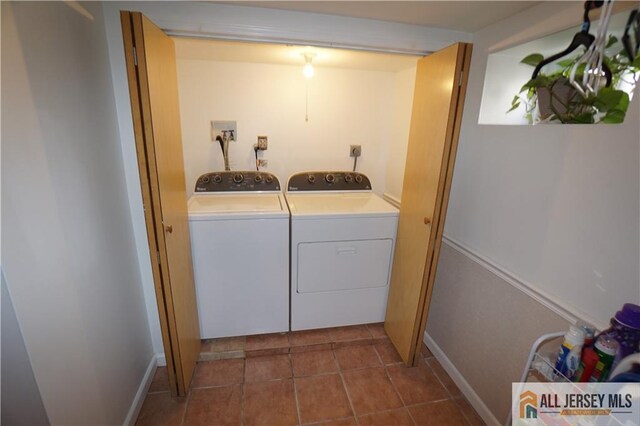 25 Clover Ave, Colonia, NJ 07067 - washroom featuring independent washer and dryer, dark tile patterned flooring, and baseboards