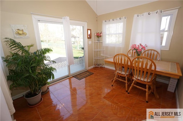 25 Clover Ave, Colonia, NJ 07067 - tiled dining space featuring healthy amount of natural light, lofted ceiling, and baseboards
