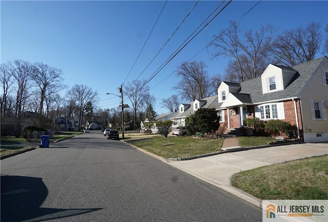 25 Clover Ave, Colonia, NJ 07067 - view of asphalt street with curbs, street lights, and a residential view