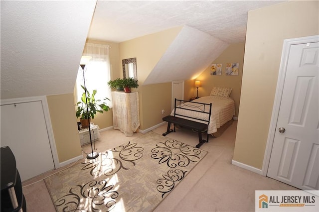 25 Clover Ave, Colonia, NJ 07067 - bedroom with a textured ceiling, light colored carpet, lofted ceiling, and baseboards