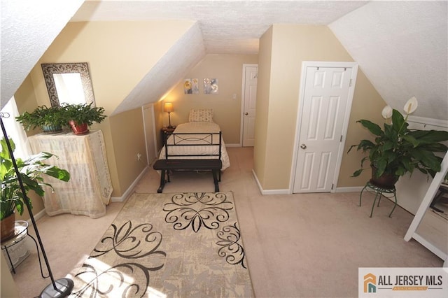 25 Clover Ave, Colonia, NJ 07067 - bedroom featuring carpet, lofted ceiling, a textured ceiling, and baseboards