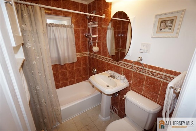 25 Clover Ave, Colonia, NJ 07067 - bathroom featuring tile walls, shower / tub combo with curtain, toilet, and a sink